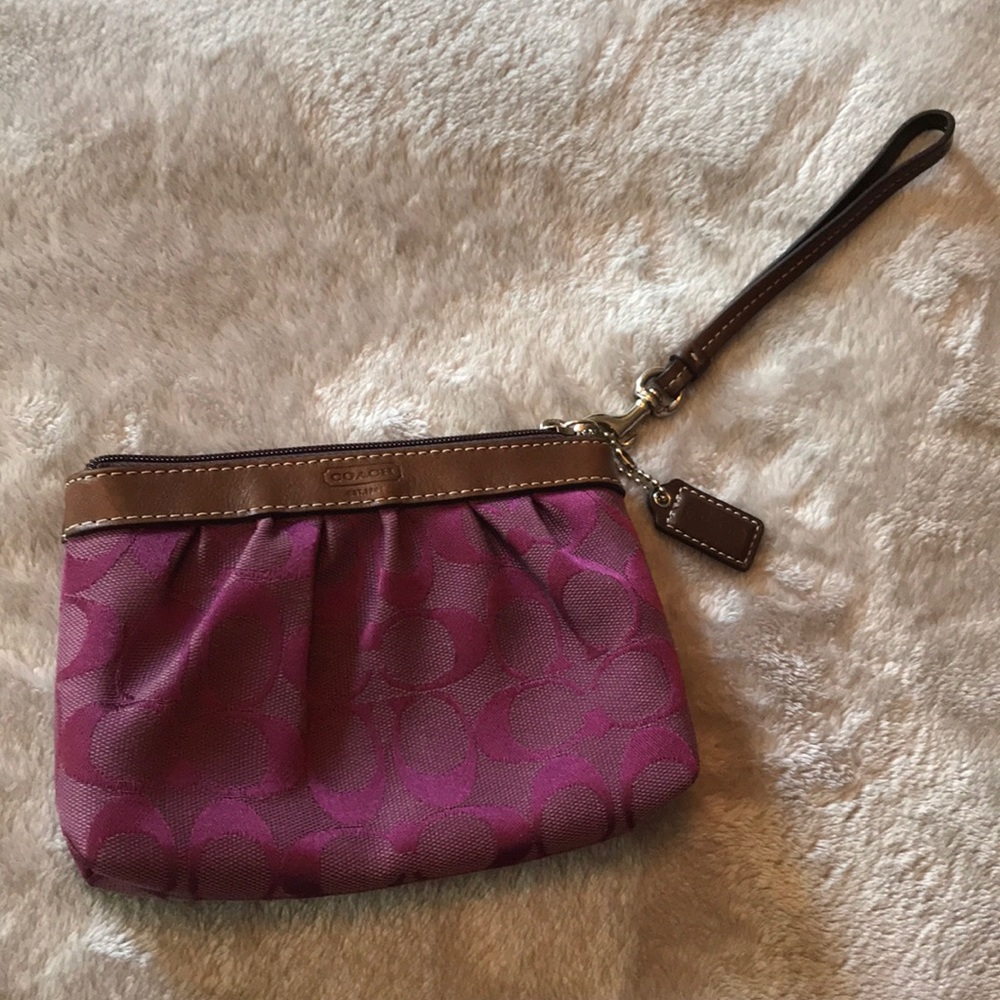 EUC Pretty Plum Coach measures 7” Wide 5” Tall